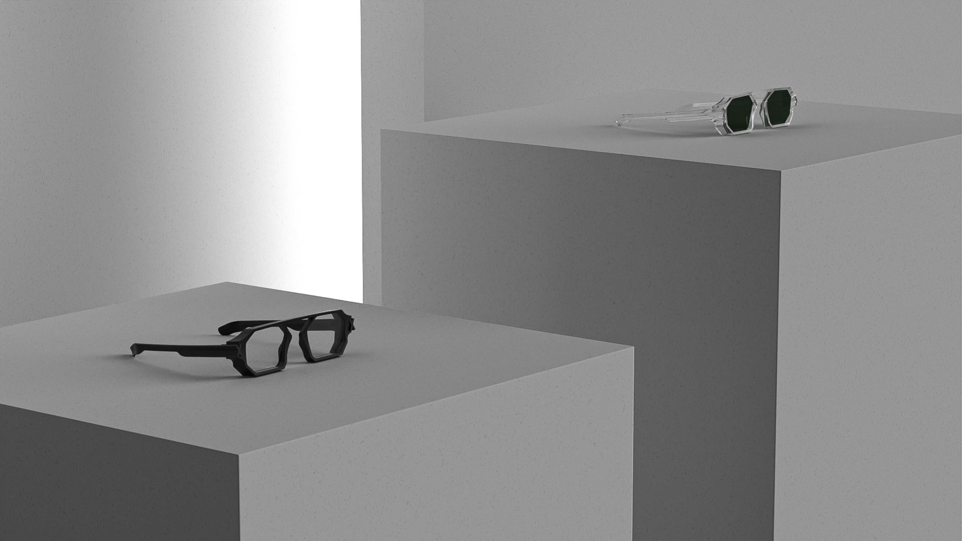 Two pairs of Unfoldable frames displayed on grey pedestals like exhibition objects.
