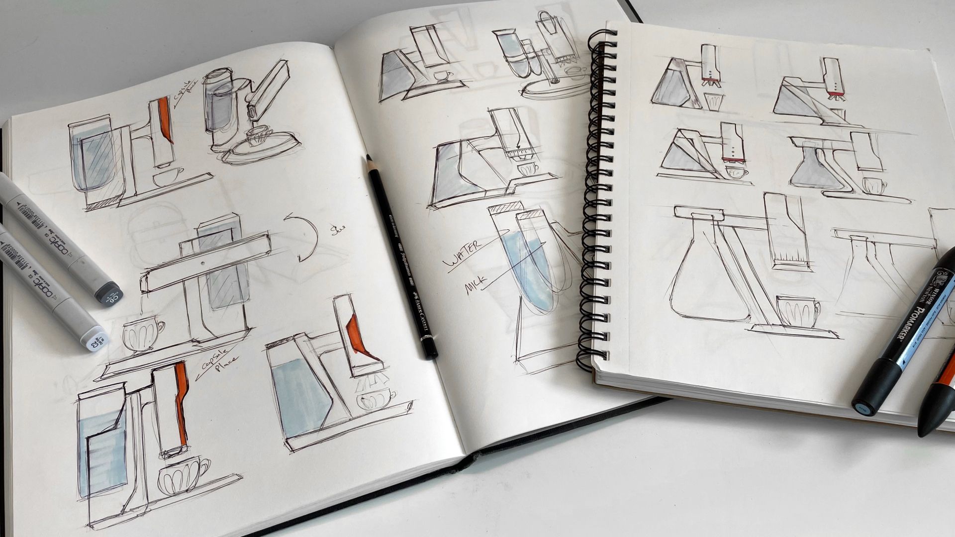 Open sketchbook with Microcoffee concept sketches and orange accents.